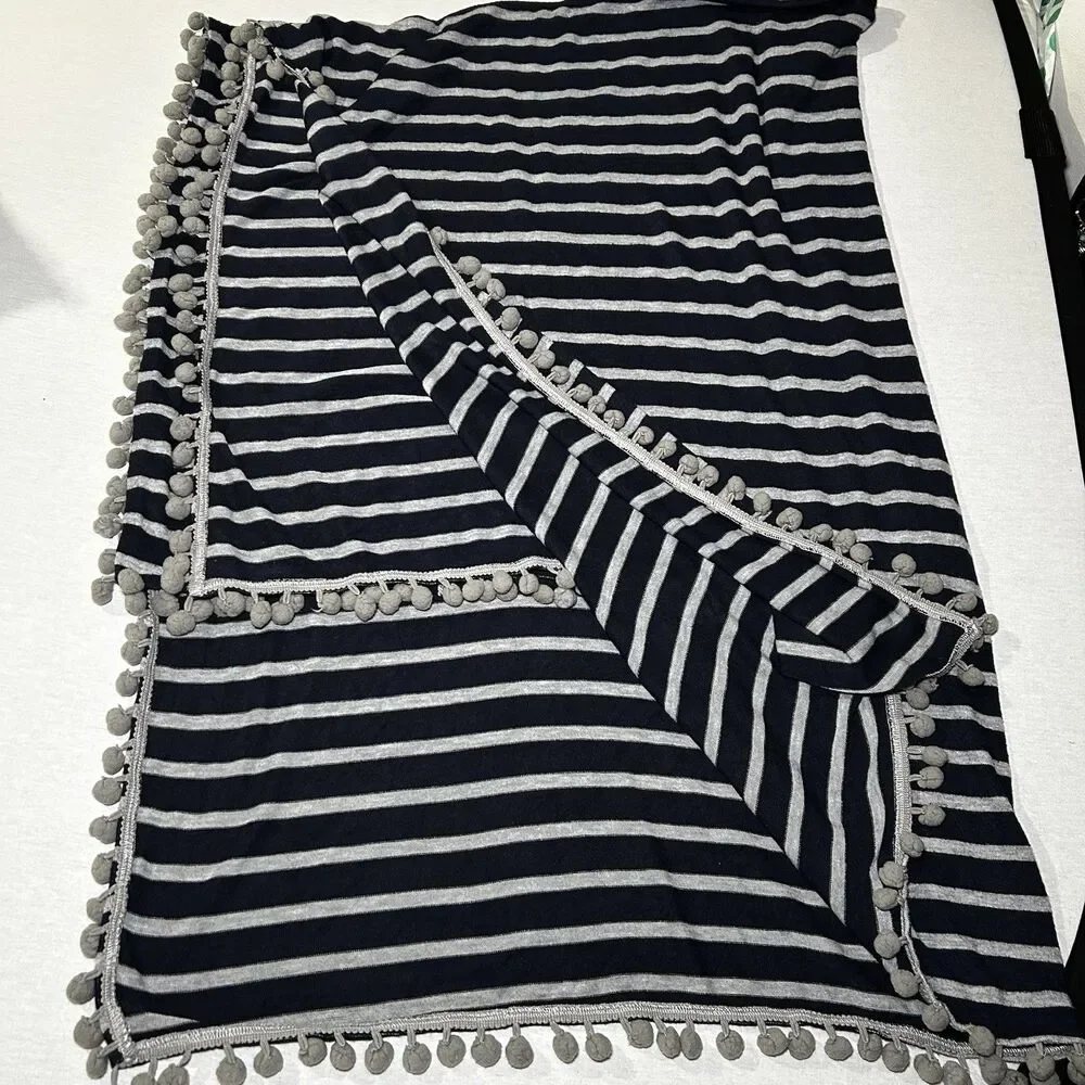 Blue and gray striped jersey throw blanket with gray pom-pom trim